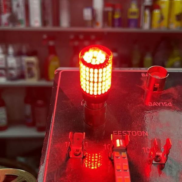 Світлодіодна автолампа P21/5W BAY15D 144 SMD 12V Червона 108584 фото